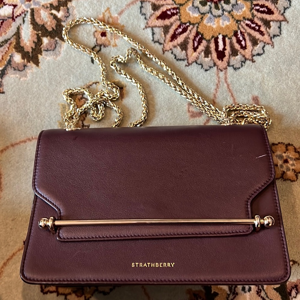 Maroon Strathberry Handbag. Small scratch in upper right corner